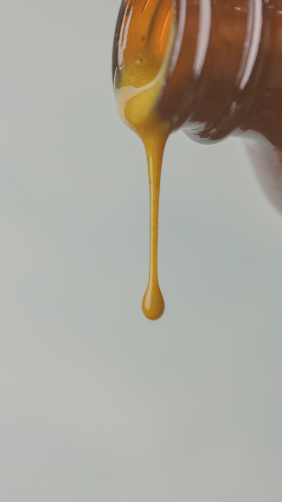 Lyfe essentials liquid pouring from amber bottle
